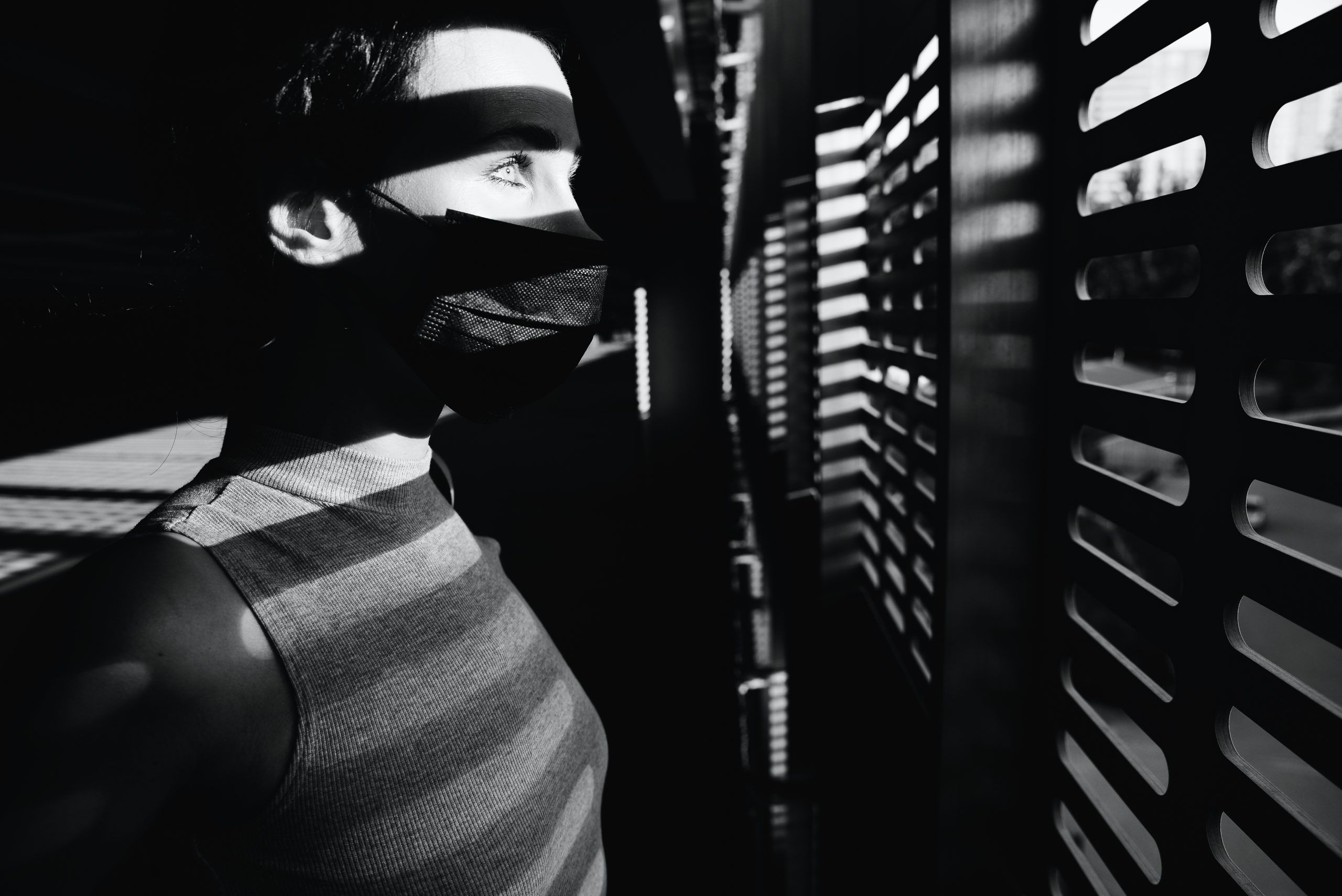 black and white photo of person looking at the window 2329794 scaled